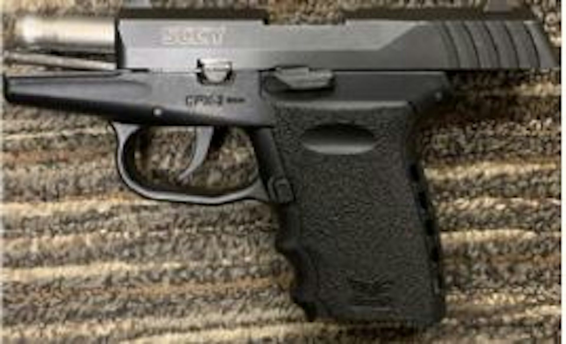 A pistol lying on a rug
