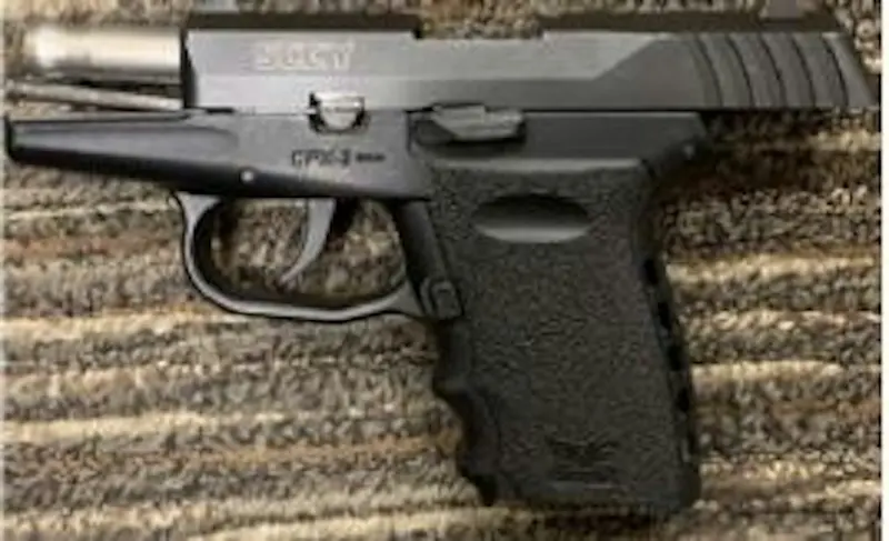 A pistol lying on a rug