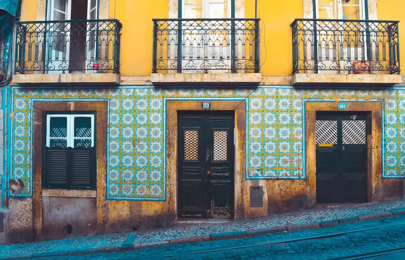 A street view of a tiled building on a steep incline. A street view of a tiled building on a steep incline.