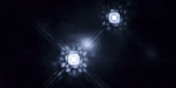 Gravitational Lensing: Hubble Sees The Disk Around A Black Hole