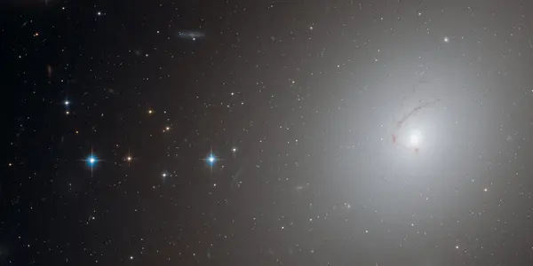 NGC 4696: Why Is It Shaped Like A Cosmic Question Mark?