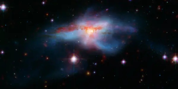 NGC 6240 - Cosmic Train Wreck By Black Holes A Million Times The Mass Of The Sun