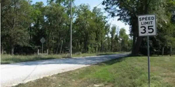 On gravel roads, people drive at speed they are comfortable with, regardless of posted limit